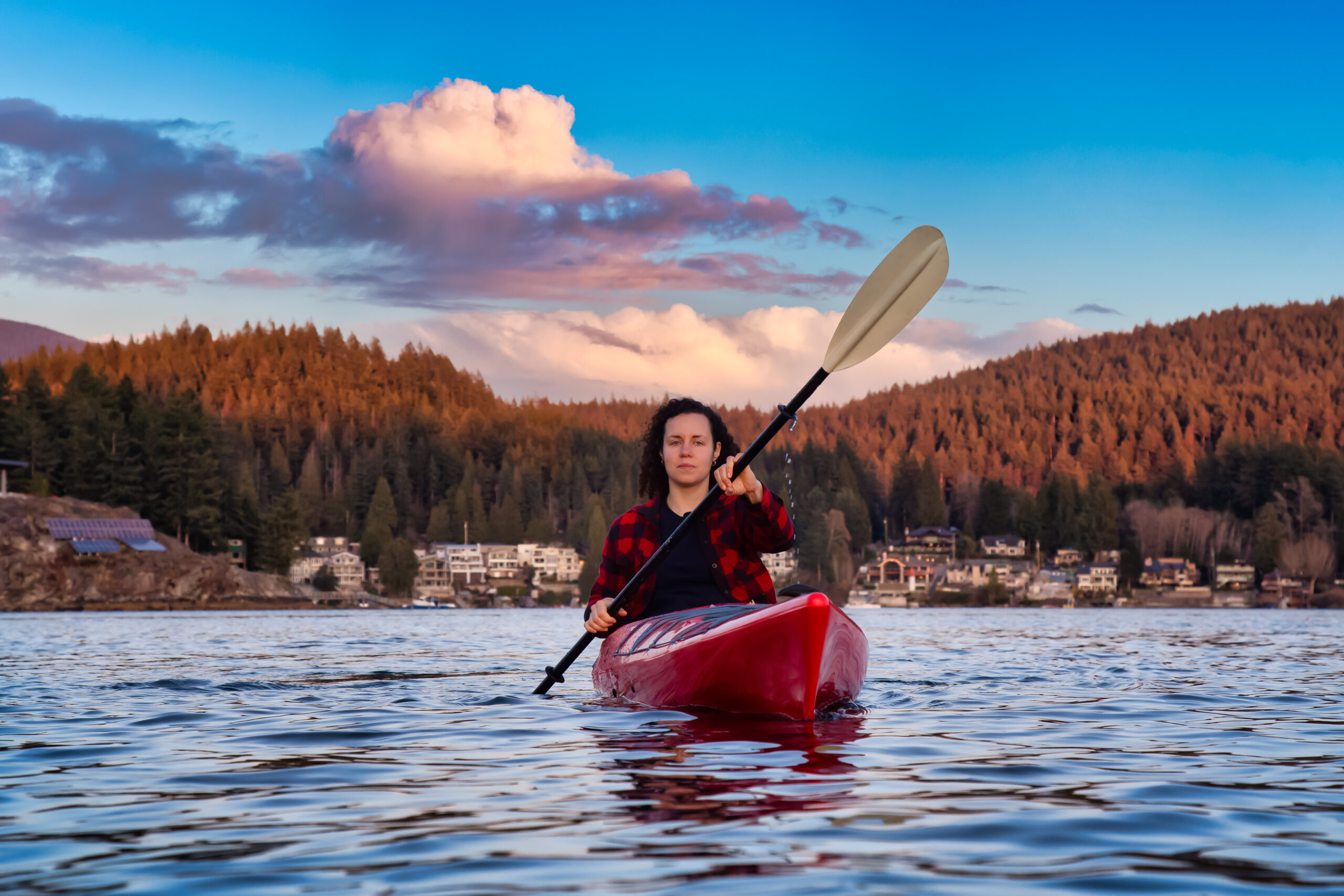 Willa Slavita - adventurous girl paddling on a bright red kayak in 2023 11 27 05 06 24 utc scaled